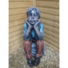 Boy Sitting on a Rock