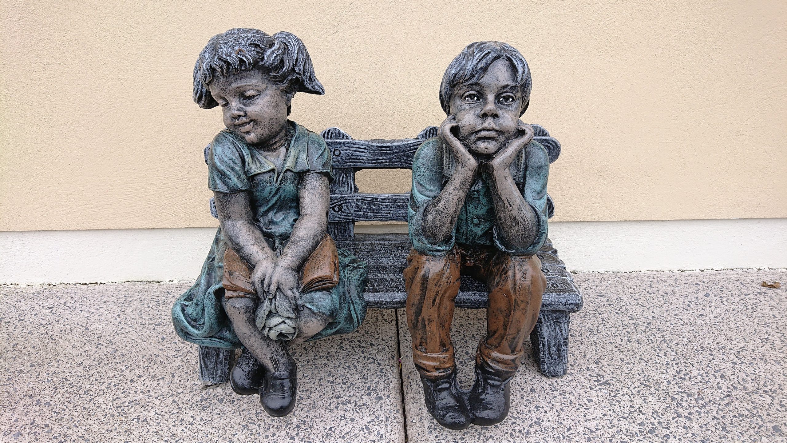 Bemused Boy and Girl on Bench