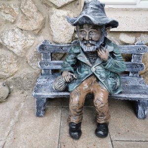 Tramp Sitting on a Bench