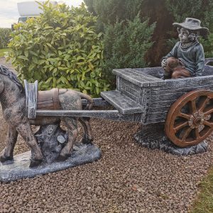 Donkey and Cart with Boy or Girl Sitting in the Cart
